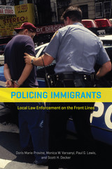 front cover of Policing Immigrants